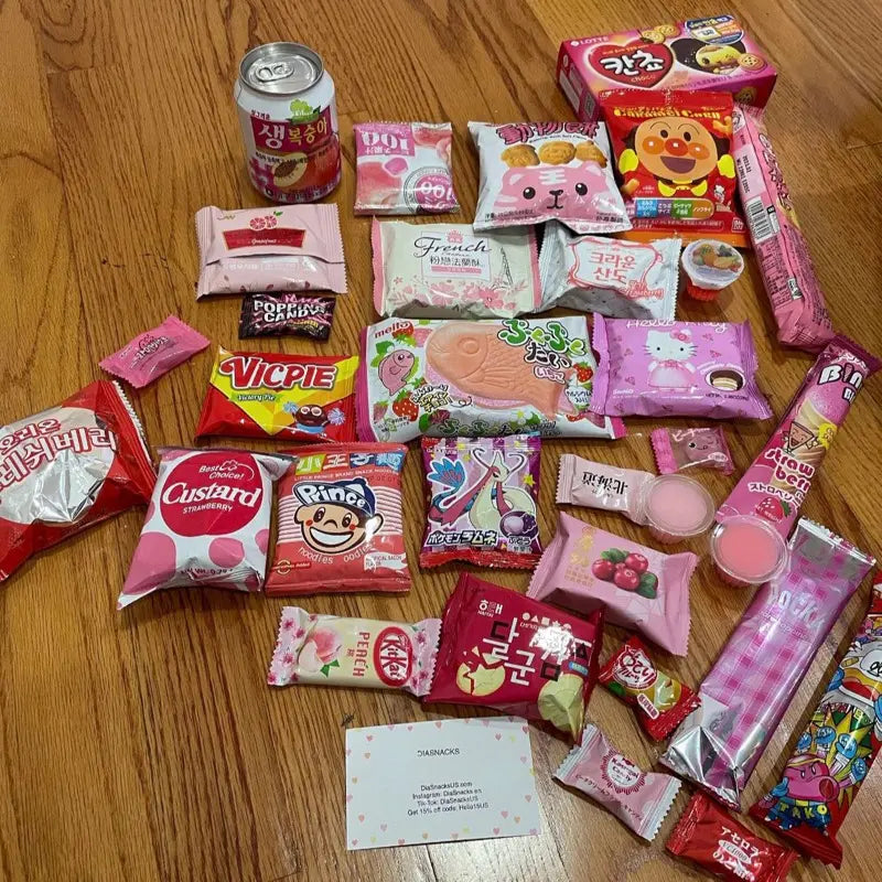 Pink Asian Snack Box with Ramen Drinks Includes Various Candy and Snacks Featuring Strawberry Flavors Sweet Dessert Macarons
