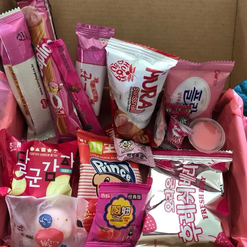 Pink Asian Snack Box with Ramen Drinks Includes Various Candy and Snacks Featuring Strawberry Flavors Sweet Dessert Macarons